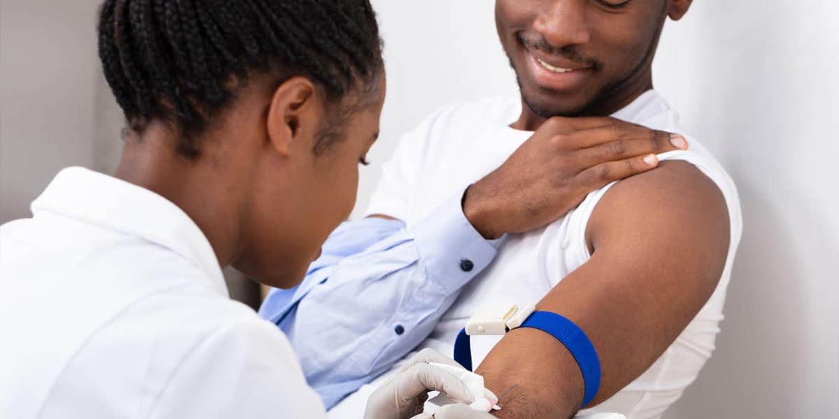 doctor injecting a man's arm