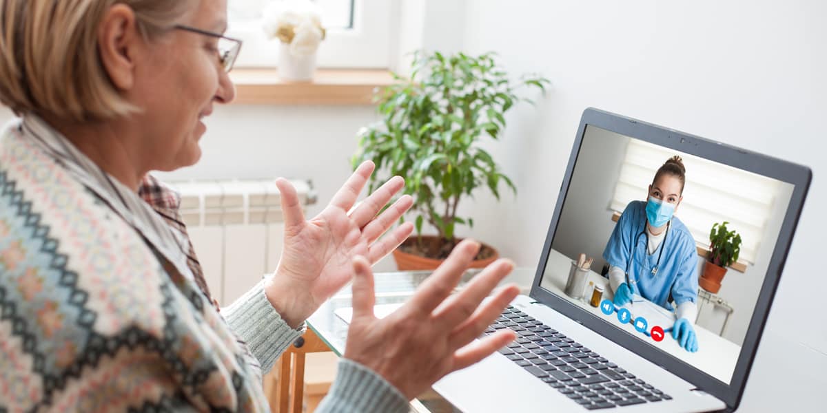 patient talking to healthcare professional over web meeting