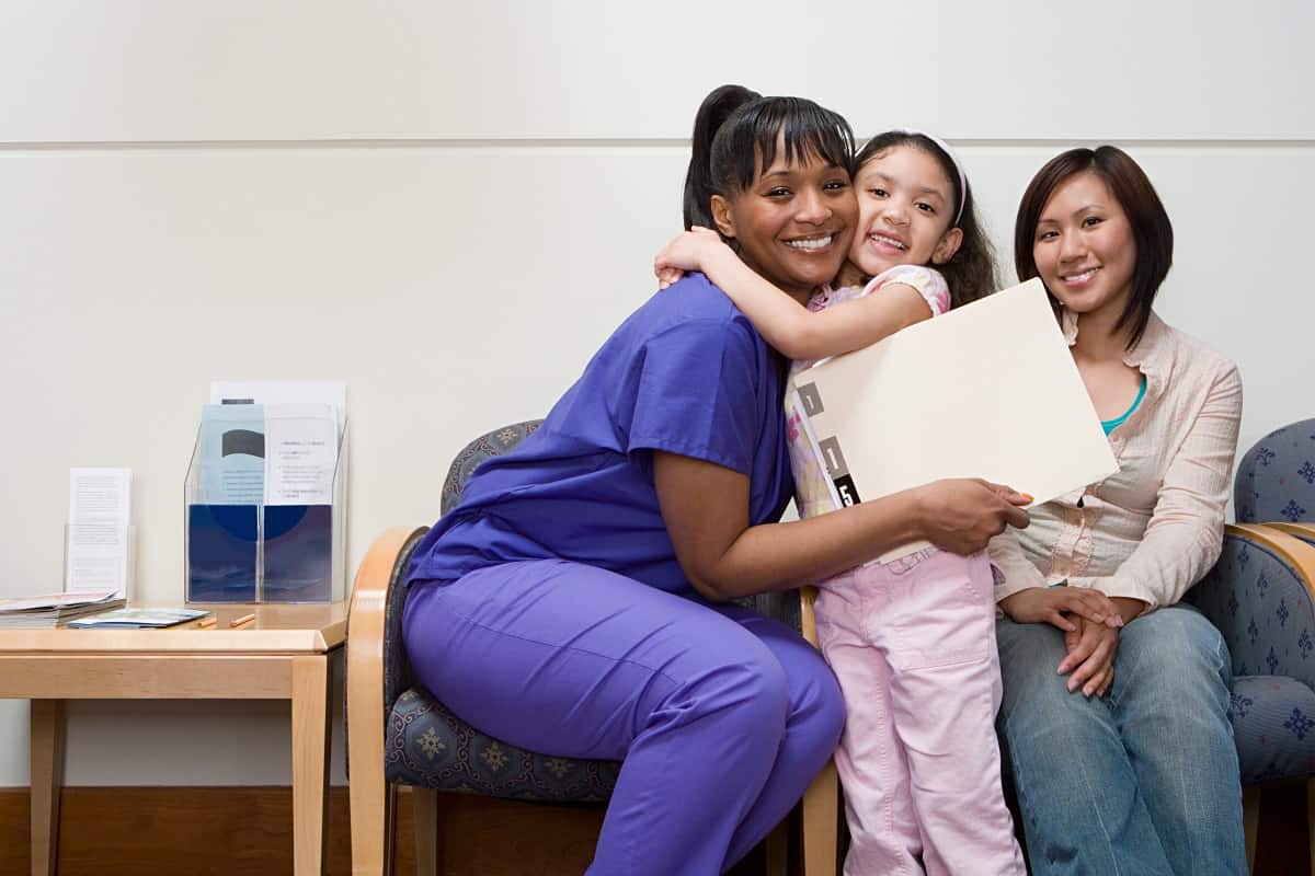 Girl hugging nurse